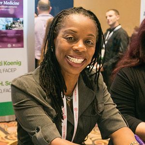 Dr. Heron at a signing for Diversity and Inclusion in Quality Patient Care at ACEP16.