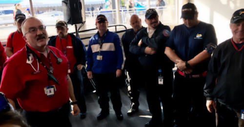 Dr. Kozak (far left) during a race morning briefing for all the on track rescue, fire, and safety personnel.